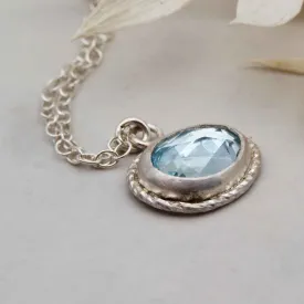 Sky blue topaz freeform framed pendant