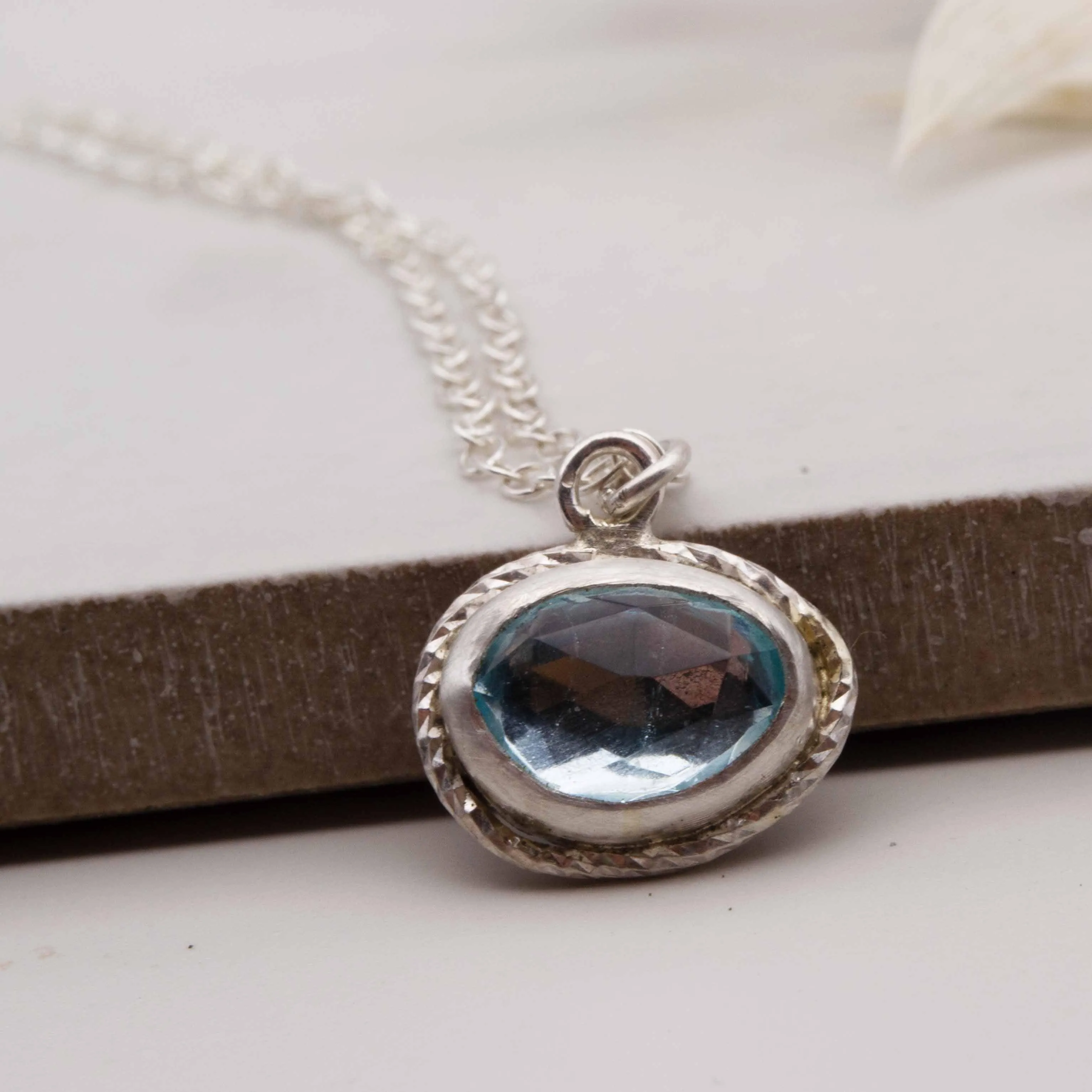 Sky blue topaz freeform framed pendant