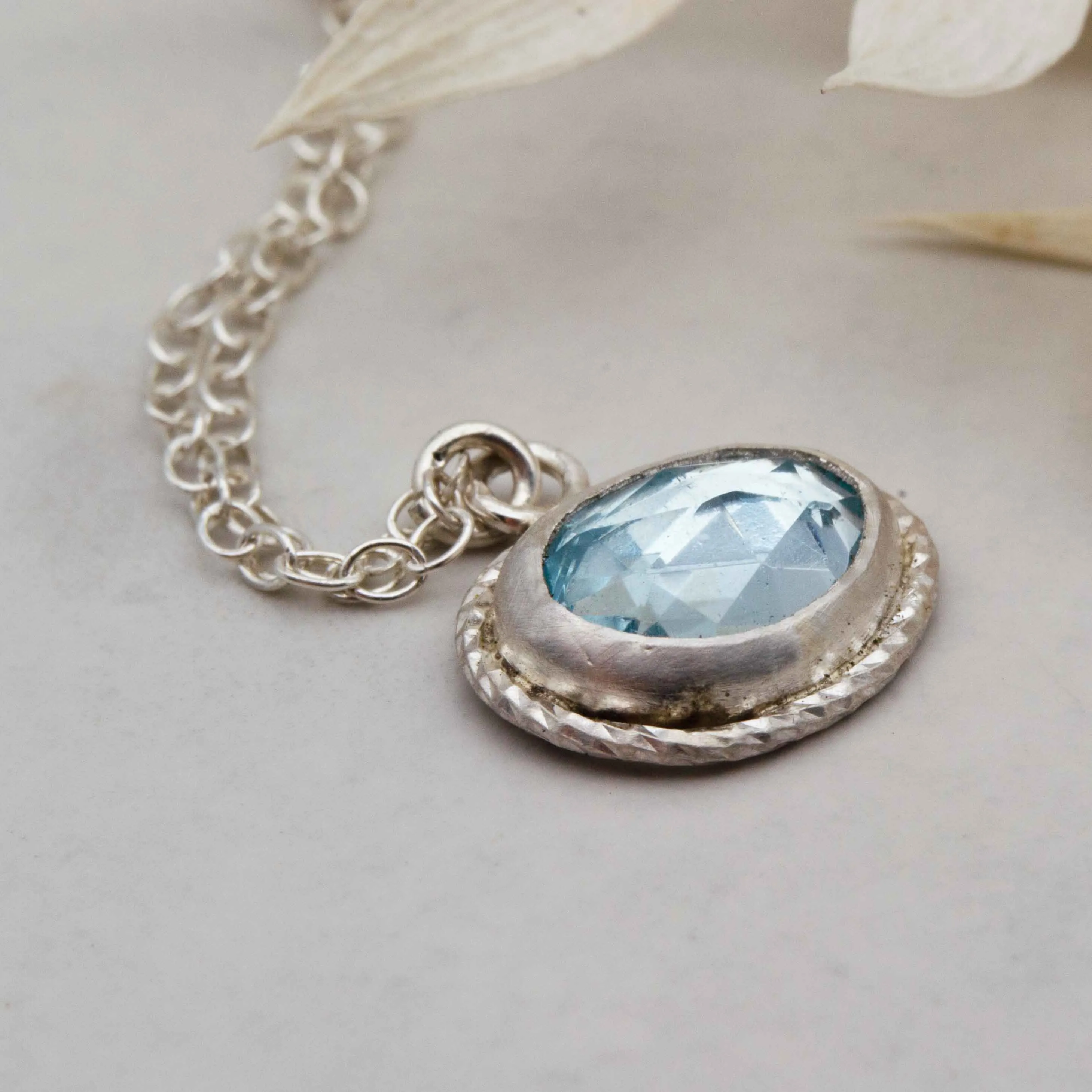 Sky blue topaz freeform framed pendant
